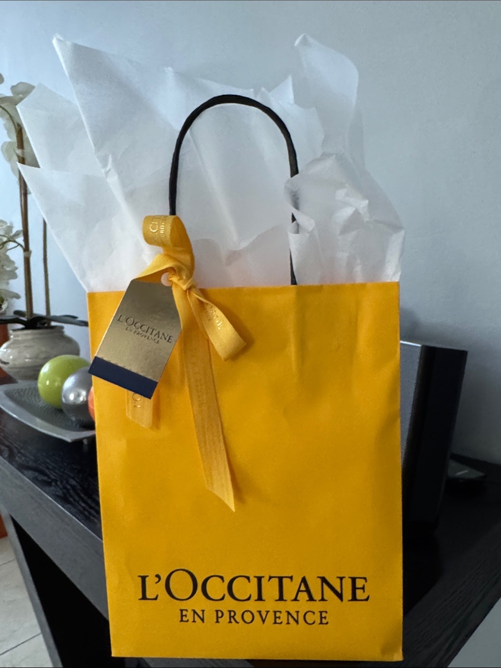 L'OCCITANE Yellow Gift Bag with Black Handles and Ribbon Tag
